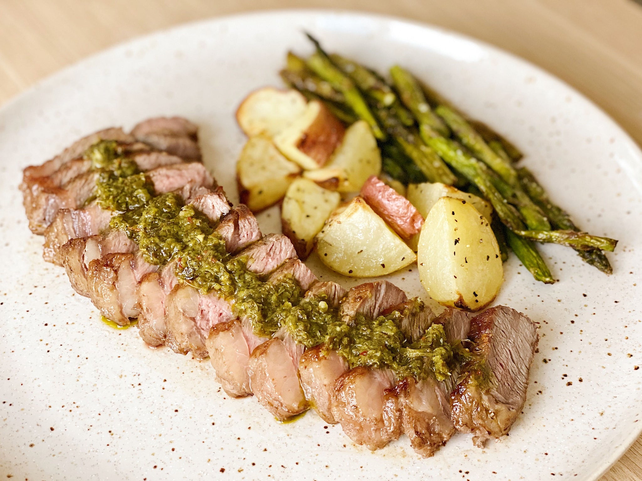 Grilled Chimichurri Strip Steak with Asparagus and Garlicky Potatoes